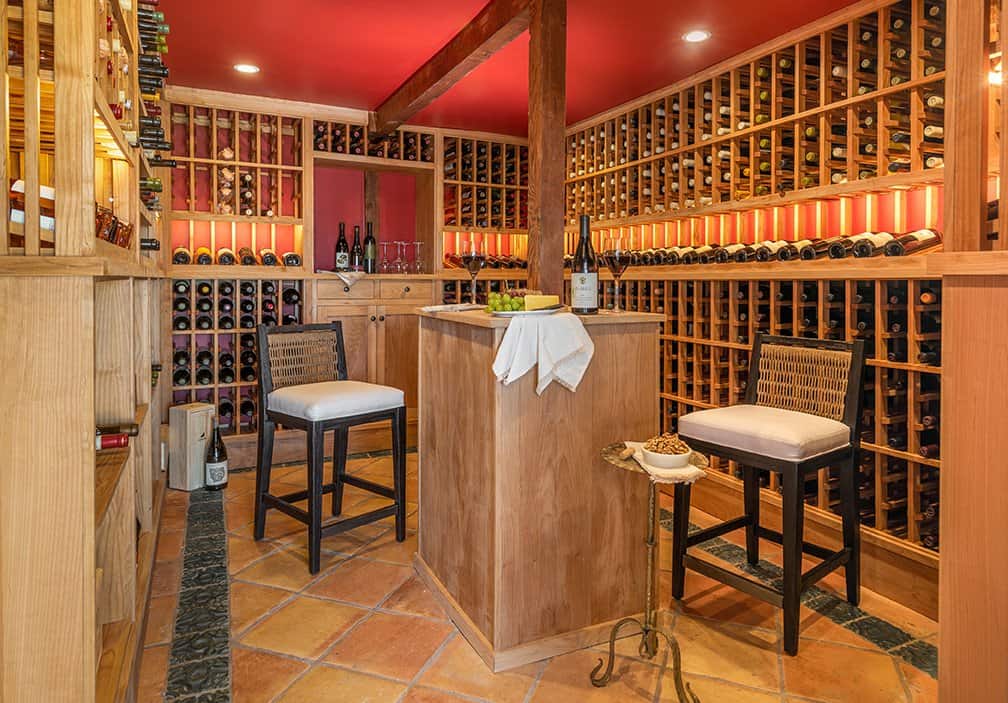 A wine room was built for storing and tasting. Photos by  Nolasco Studios.  