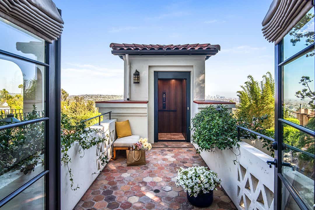  Home Front Build seamlessly installed an elevator so the clients could avoid climbing the 40 stairs to the entrance. Photos by  Nolasco Studios.  