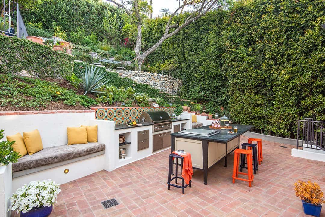  The barbecue area island stools are by Room & Board and the outdoor kitchen is Lynx, found through Snyder-Diamond. Photos by  Nolasco Studios.  