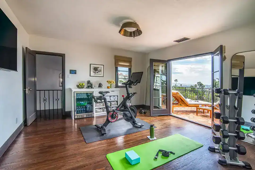  A terrace extends off the home gym with inspirational views. Photos by  Nolasco Studios.  